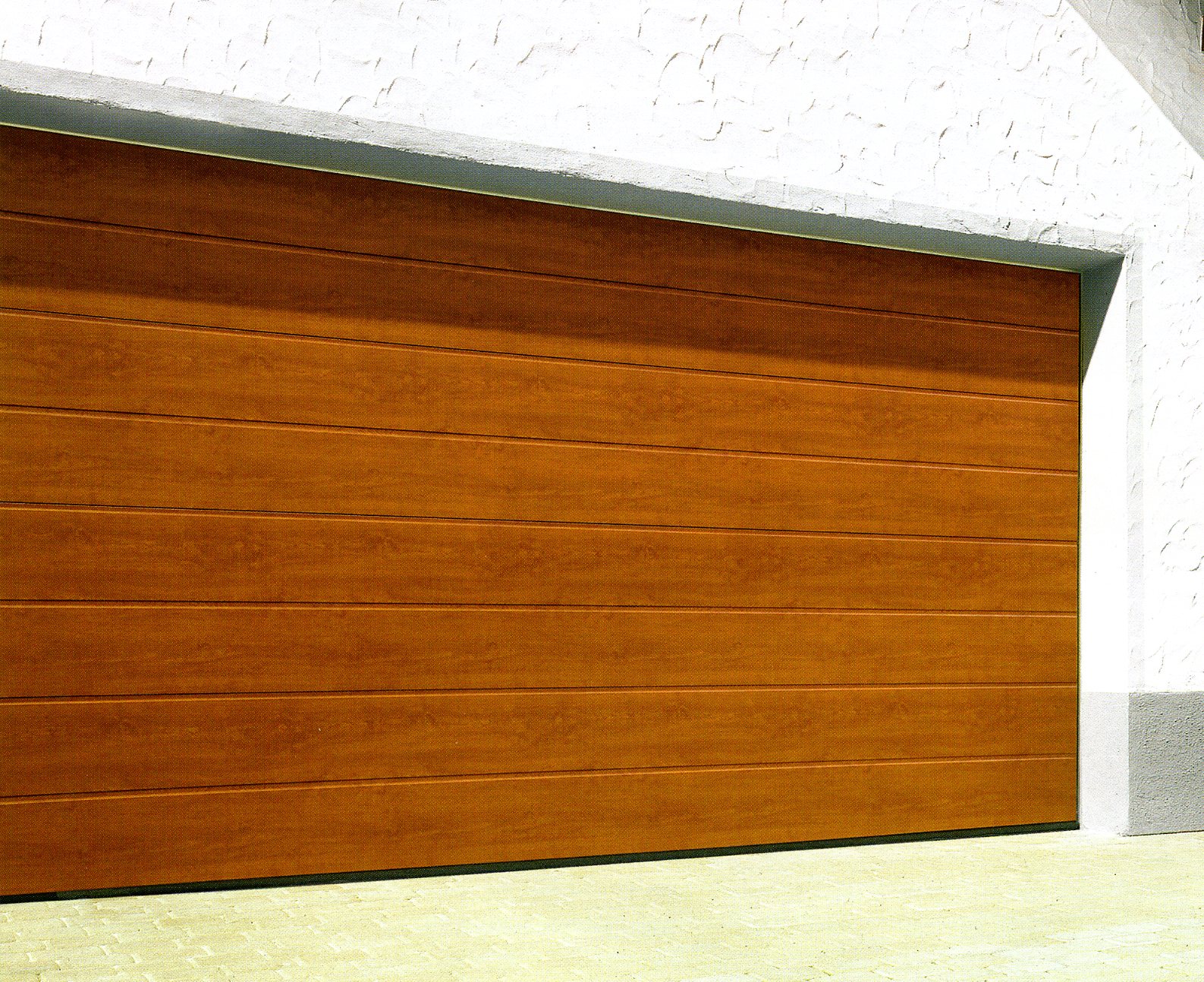 Hormann M-Rib sectional garage door in Golden Oak laminate finish          